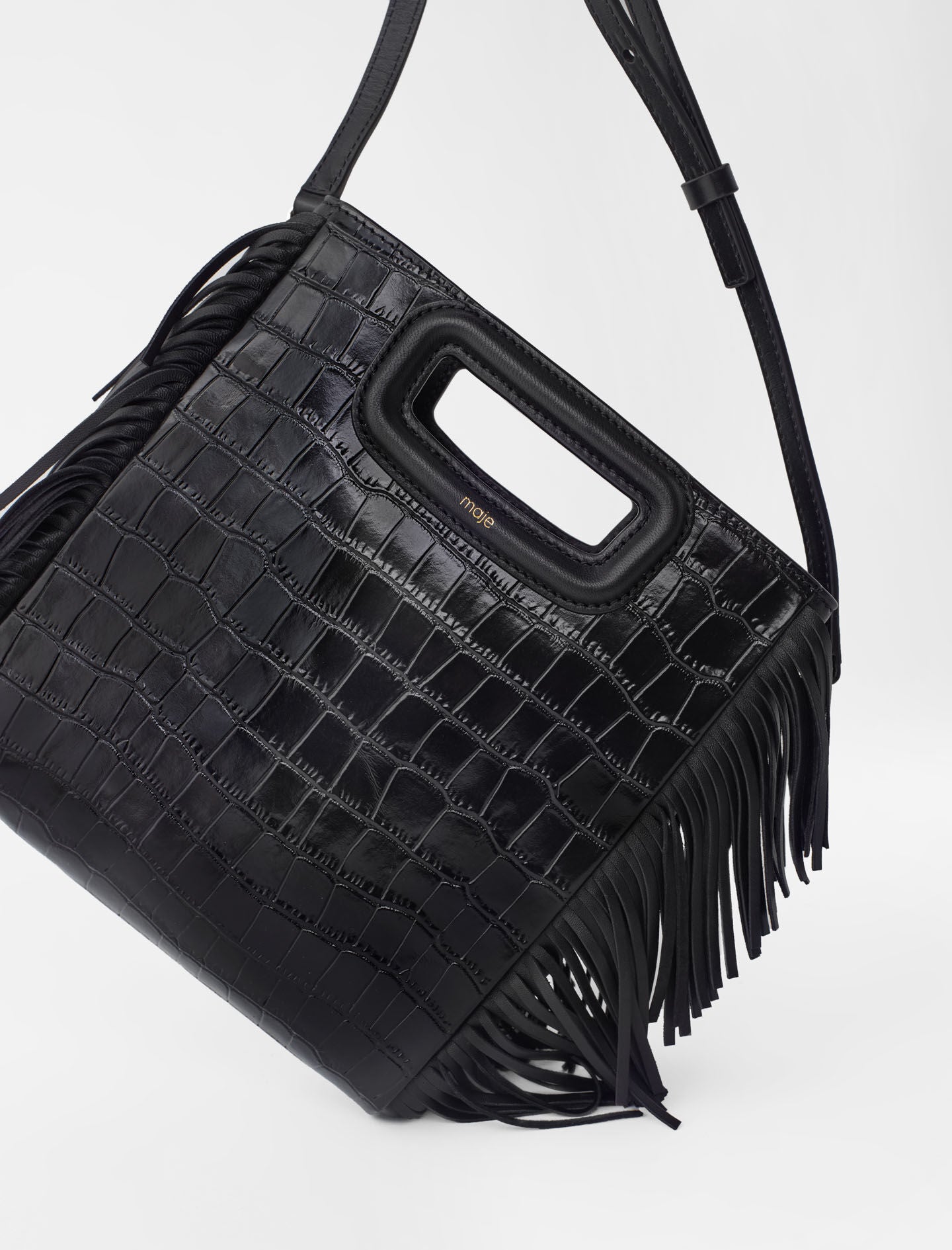 Black featured-fringed leather m bag